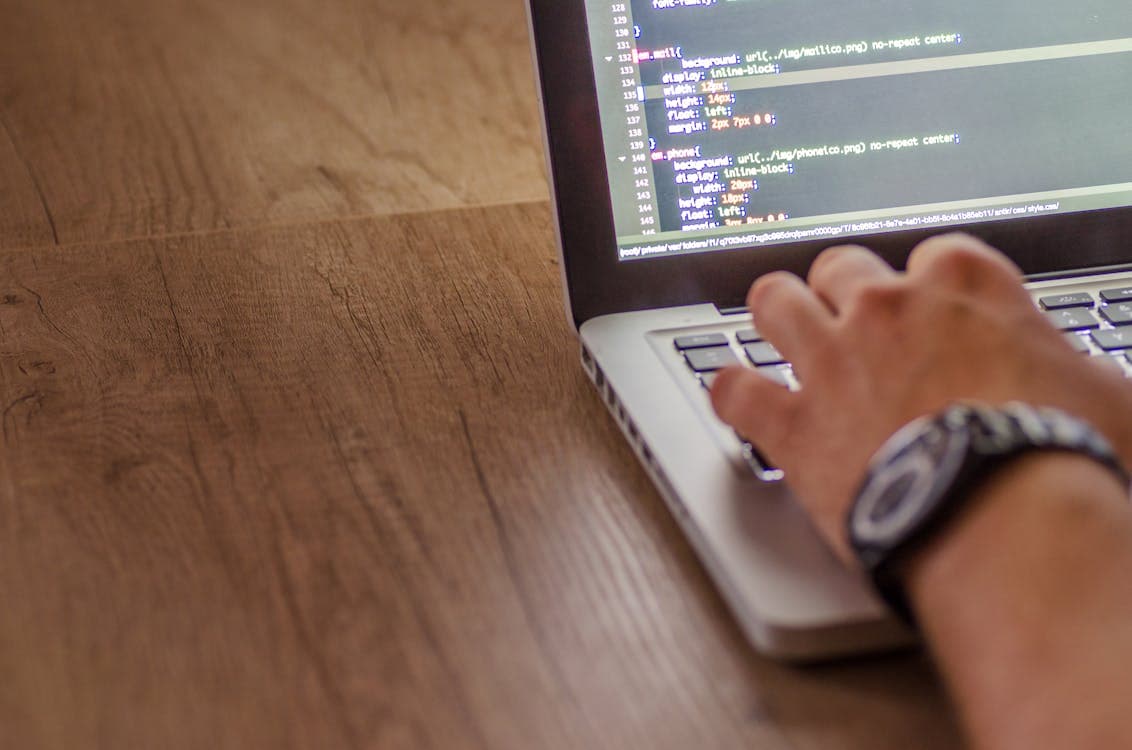 Laptop displaying programming code
